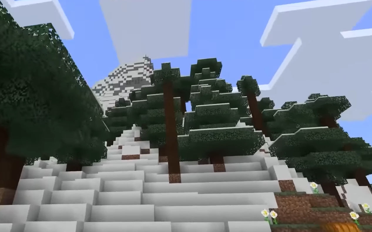 Игровой кадр Minecraft: снежные горы и ели